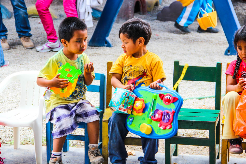 Kids playing with their new toys during Christmas in Peru